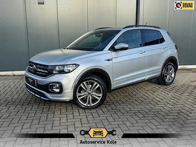Grijs (metallic) Gebruikt 2022 VW T-Cross R-line SUV | € 22.940 (Eerlijke prijs) - Afbeelding 1/4
