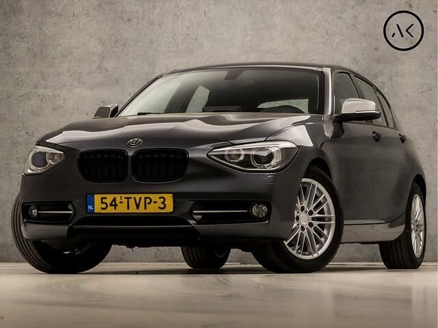 Grijs Gebruikt 2012 BMW 116 Sport Line Hatchback | € 9.945 (Eerlijke prijs) - Afbeelding 1/4