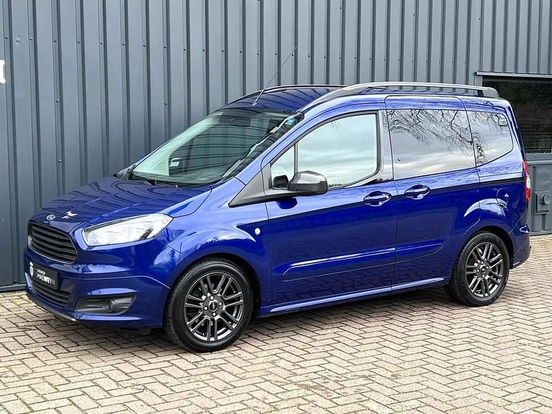 Blauw (metallic) Gebruikt 2018 Ford Tourneo Titanium Van | € 13.949 (Eerlijke prijs) - Afbeelding 1/4