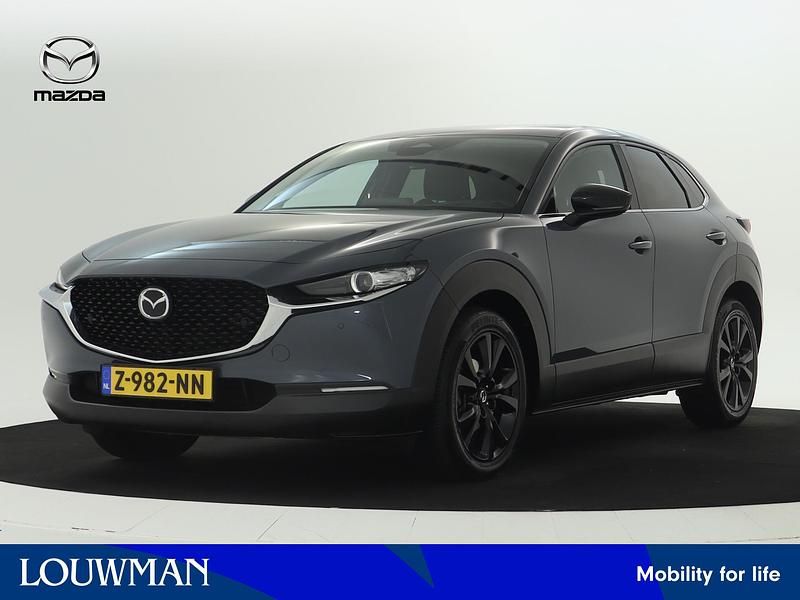 Grijs, metallic lak Gebruikt 2024 Mazda CX-30 Homura-Line SUV | € 31.945 (Eerlijke prijs) - Afbeelding 1/3