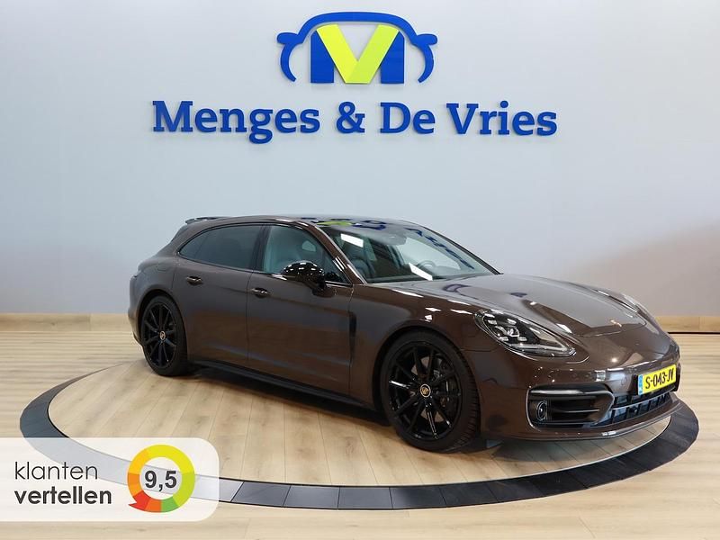 Bruin (metallic) Occasion 2023 Porsche Panamera Platinum Edition Stationwagen | € 98.495 (Goede deal) - Afbeelding 1/4