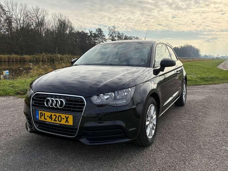 Zwart Gebruikt 2012 Audi A1 Attraction Hatchback | € 6.150 (Goede deal) - Afbeelding 1/4