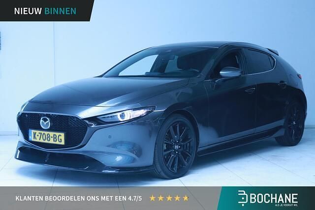 Machine gray (46g) Gebruikt 2020 Mazda 3 Luxury Hatchback | € 17.425 (Eerlijke prijs) - Afbeelding 1/4