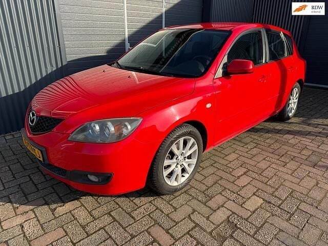 Rood Occasion 2007 Mazda 3 Touring Hatchback | € 2.750 (Eerlijke prijs) - Afbeelding 1/4