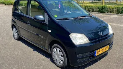 Occasion Daihatsu Cuore 58 PK (42 kW) 2006 Zwart Hatchback