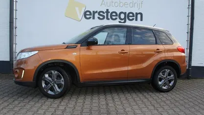 Oranje Occasion 2015 Suzuki Vitara Exclusive SUV | € 14.950 (Eerlijke prijs)