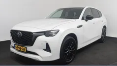 Rhodium white (wit metallic) Gebruikt 2023 Mazda CX-60 Homura-Line SUV | € 38.750 (Eerlijke prijs)