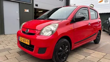 Occasion Daihatsu Cuore 69 PK (50 kW) 2010 Rood Hatchback
