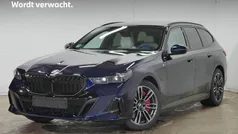 Blauw Gebruikt 2025 BMW 550e M Sport Stationwagen | € 87.895 (Super prijs)