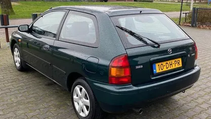 Occasion Mazda 323 88 PK (64 kW) 1999 Groen, metallic lak Hatchback