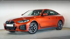 Sunset orange metallic (oranje metallic) Gebruikt 2023 BMW i4 Shadowline Sedan | € 43.495 (Super prijs)
