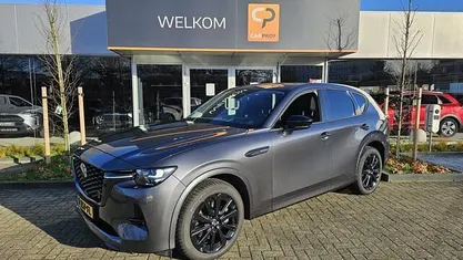 Grijs (metallic) Occasion 2023 Mazda CX-60 Takumi-Line SUV | € 38.895 (Eerlijke prijs)