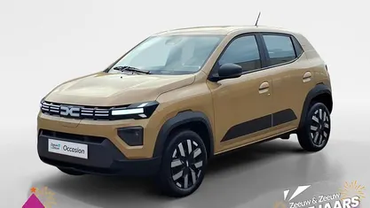 Beige safari hnw Nieuw 2025 Dacia Spring Expression Hatchback | € 17.995 (Goede deal)
