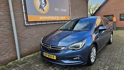 Blauw (metallic) Occasion 2016 Opel Astra Business Stationwagen | € 4.745 (Eerlijke prijs)