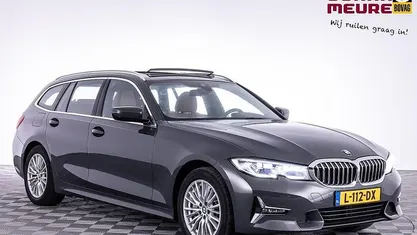 Grijs Occasion 2021 BMW 330e Executive Stationwagen | € 31.990 (Super prijs)