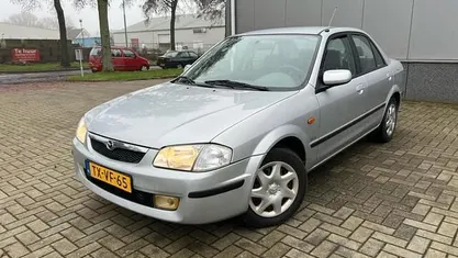 Occasion Mazda 323 88 PK (64 kW) 1998 Grijs Sedan
