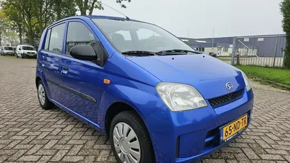 Occasion Daihatsu Cuore 58 PK (42 kW) 2003 Blauw Hatchback
