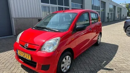 Occasion Daihatsu Cuore 69 PK (50 kW) 2008 Rood Hatchback