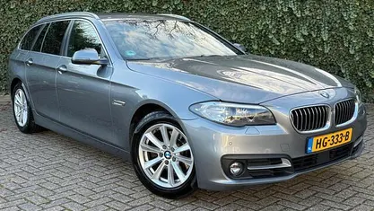 Grijs Occasion 2015 BMW 518 Executive Stationwagen | € 12.495 (Eerlijke prijs)
