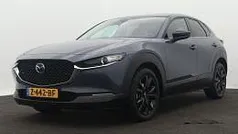 Polymetal grey (grijs metallic) Gebruikt 2024 Mazda CX-30 Homura-Line SUV | € 33.945 (Eerlijke prijs)