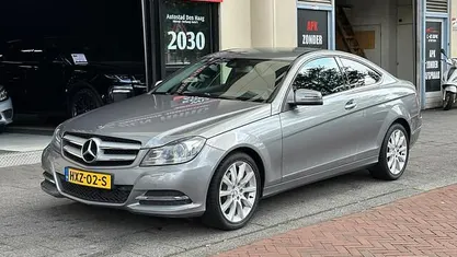 Occasion Mercedes C200 Ambition 184 PK (135 kW) 2012 Grijs, metallic lak Coupé