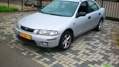 Occasion Mazda 323 73 PK (53 kW) 1997 Grijs Sedan