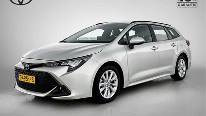Gebruikt 2023 Toyota Corolla Hybrid Active Stationwagen | € 24.445 (Eerlijke prijs)