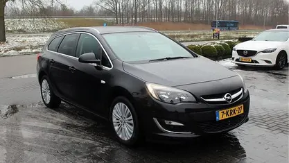 Occasion Opel Astra Design Edition 120 PK (88 kW) 2013 Zwart Stationwagen
