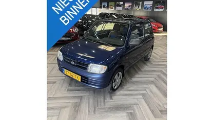 Occasion Daihatsu Cuore 56 PK (41 kW) 2001 Blauw Hatchback
