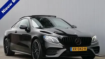 Zwart (metallic) Gebruikt 2018 Mercedes E200 Premium Plus Coupé | € 31.895 (Goede deal)