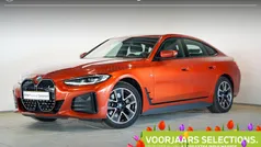 Sunset orange metallic (oranje metallic) Gebruikt 2023 BMW i4 Shadowline Sedan | € 43.495 (Super prijs)