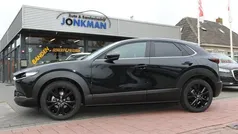 Zwart, metallic lak Gebruikt 2024 Mazda CX-30 Homura-Line SUV | € 33.850 (Eerlijke prijs)