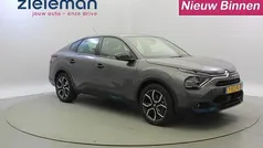Grijs, metallic lak Gebruikt 2023 Citroën e-C4 Feel Sedan | € 17.845 (Super prijs)