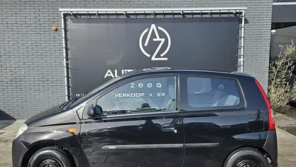 Occasion Daihatsu Cuore 58 PK (42 kW) 2006 Zwart Hatchback