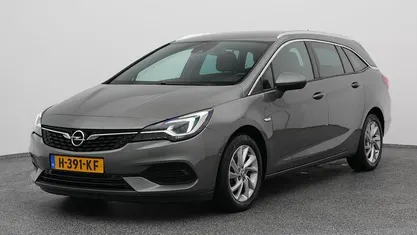 Occasion Opel Astra Elegance 112 PK (82 kW) 2020 Grijs (metallic) Stationwagen
