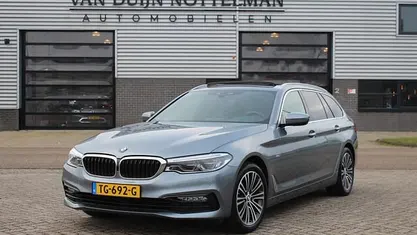 Grijs Occasion 2018 BMW 520 Executive Stationwagen | € 19.950 (Goede deal)