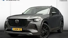 Machine grey (grijs metallic) Gebruikt 2023 Mazda CX-60 Homura-Line SUV | € 43.750 (Goede deal)