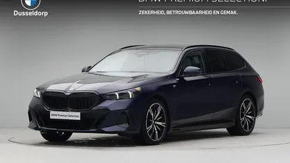 Occasion BMW 550e M Sport 489 PK (359 kW) 2024 Blauw Stationwagen
