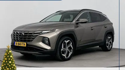 Silky bronze metallic (b6s) Gebruikt 2021 Hyundai Tucson Comfort SUV | € 23.900 (Eerlijke prijs)