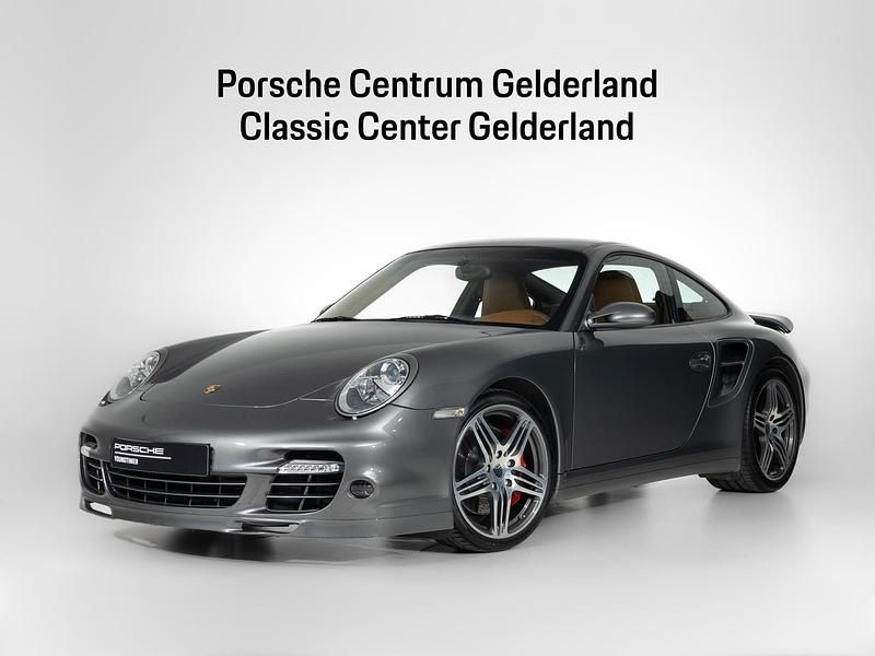 Grijs (metallic) Occasion 2008 Porsche 997 Turbo Coupé | € 122.900 - Afbeelding 1/4