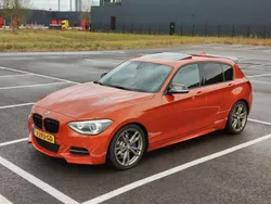 Oranje Gebruikt 2013 BMW 135 Hatchback | € 21.250
