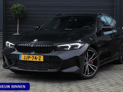 Zwart Gebruikt 2023 BMW 320e M Sport Stationwagen | € 37.995 (Eerlijke prijs)