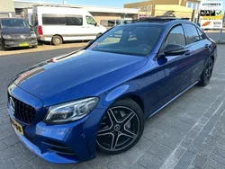 Blauw, metallic lak Gebruikt 2019 Mercedes C180 AMG Sedan | € 32.999 (Duur)