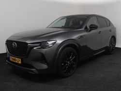 Machine gray (grijs metallic) Gebruikt 2023 Mazda CX-60 Homura-Line SUV | € 42.750 (Eerlijke prijs)