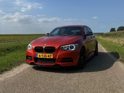 Oranje Gebruikt 2013 BMW 135 Hatchback | € 22.999