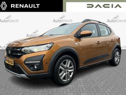 Oranje (metallic) Gebruikt 2021 Dacia Sandero Comfort Hatchback | € 17.950