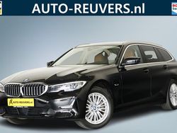 Zwart Gebruikt 2022 BMW 320e Executive Stationwagen | € 31.900 (Goede deal)