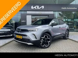 Grijs, metallic lak Gebruikt 2021 Opel Mokka-e Ultimate SUV | € 17.495 (Eerlijke prijs)