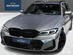 Grijs (metallic) Gebruikt 2022 BMW 330e M Sport Stationwagen | € 41.450 (Eerlijke prijs)