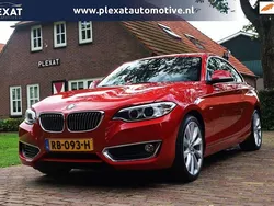 Rood, metallic lak Gebruikt 2016 BMW 230 Executive Coupé | € 19.445